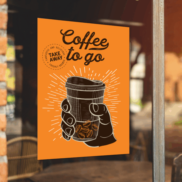 A photo of a window of a coffee shop with a decal in the window that is orange with an illustration of a hand holding a to-go coffee cup with lid colored in black with white outlines. Above in black, script text are the words, "Coffee to go." The decal is printed on GF 221.