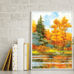 A photo of books standing upright next to a framed painting of a river running through a forest in autumn. The wallpaper contains imagery that looks like a white brick wall. The wallpaper was printed on GF 229HTR.