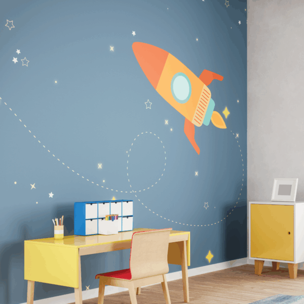 A photo of a child's room with a yellow desk and chair. The wallpaper on the wall is dark blue with stars and and orange spaceship. The wallpaper was printed on GF 234.