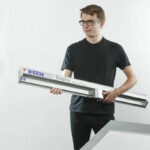 Technician holding KeenCut Simplex Cutter