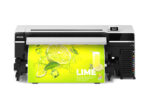 Photo of the front view of the Epson SureColor S9170 printing a large green and yellow image containing a lime and a glass of juice with the text, "LIME," in white and all-caps.