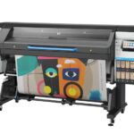 A front facing photo of the HP Latex 730 printer with abstract artwork being printed.