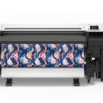 Photo of an Epson SureColor F9570 printer with a roll of media having a seamless pattern printed on it.