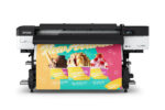 A photo of the Epson SureColor S7170 from the front. It is printing a large job with yellow, teal, and magenta with pictures of icecream in colorful, paper cups.