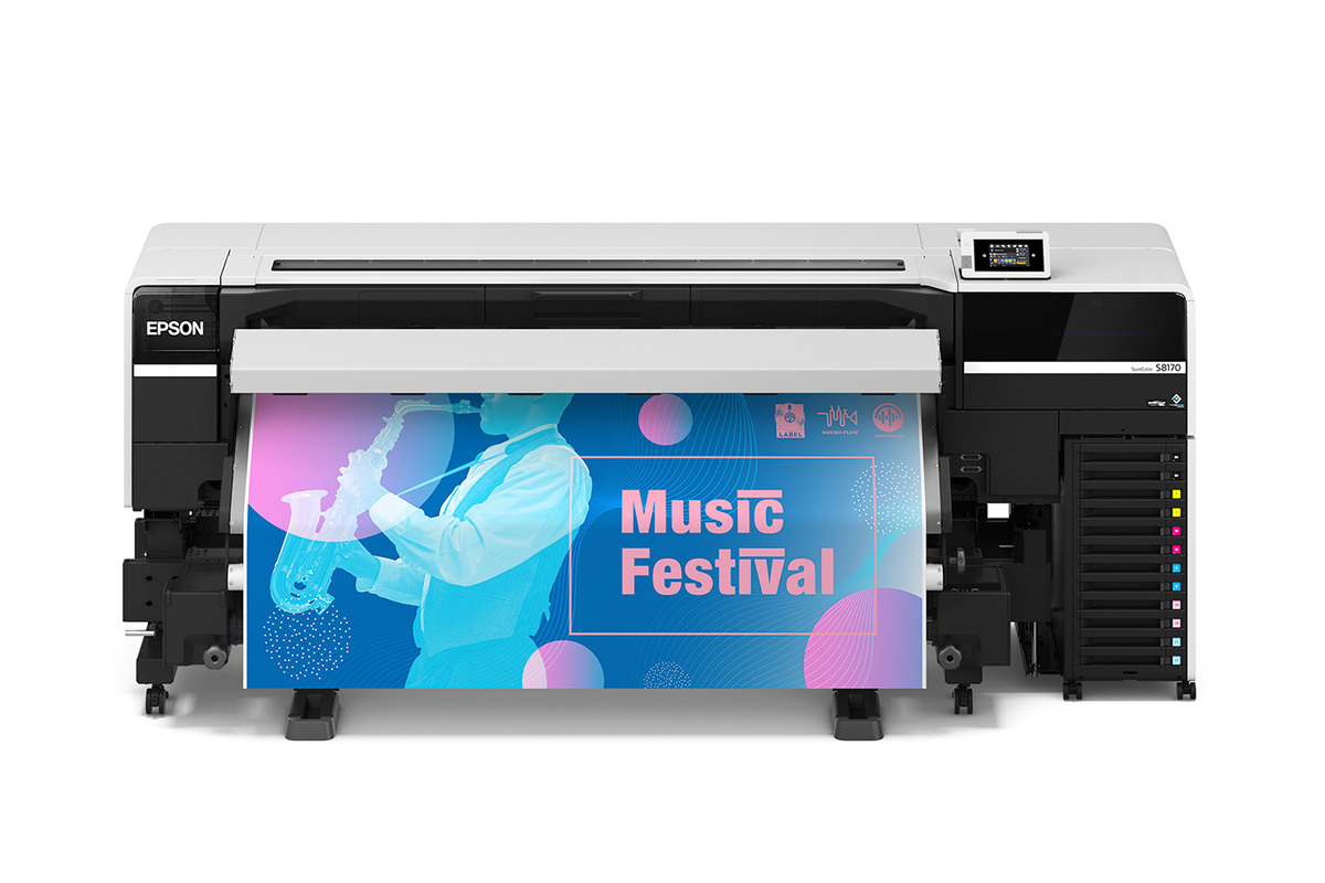 Epson SureColor S8170 64″ Printer A photo of front view of the Epson SureColor S8170 64″ Printer with a blue and pink print coming out with the words "music festival."