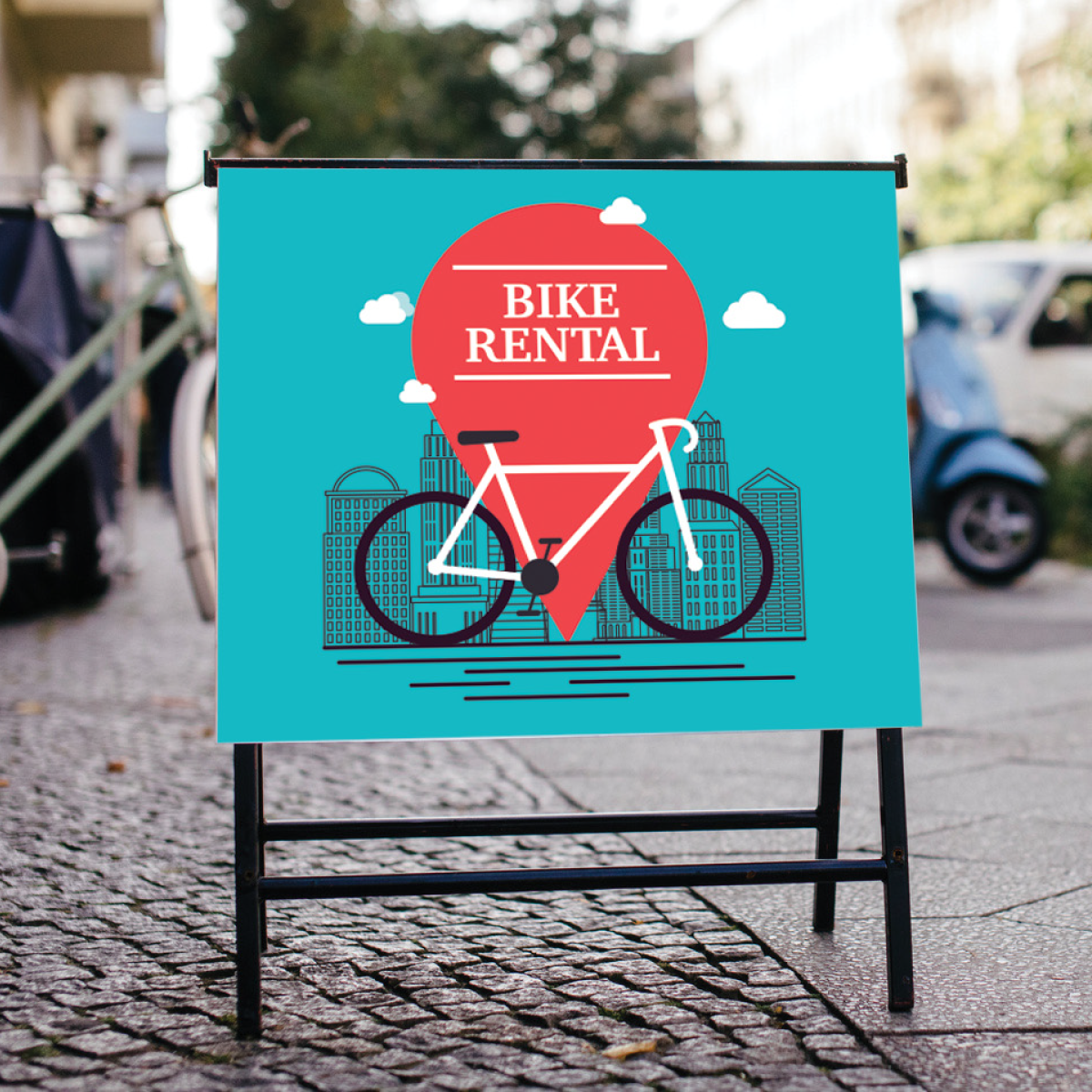 201OP_Image_square Photo of a teal colored sign sitting on a black a-frame. It has an illustration of a white and black bicycle with white clouds and a black city skyline. There is a red location marker behind the bicycle. There is white text on the red marker that reads, "Bike Rental." The sign was printed on GF 201OP.