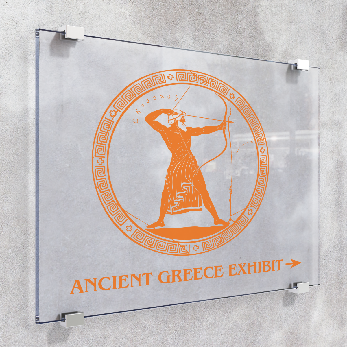 255_OptiMark_Image_square A photo of a grey wall with four metal clips attached to the wall. The clips are holding a piece of clear glass with an orange graphic on it. The graphic is a circle outlined with various patterns and an ancient greek man aiming a bow and arrow. Below is orange text that reads, "Ancient Greece Exhibit," with an arrow pointing to the right. The orange graphic is printed on GF 255.